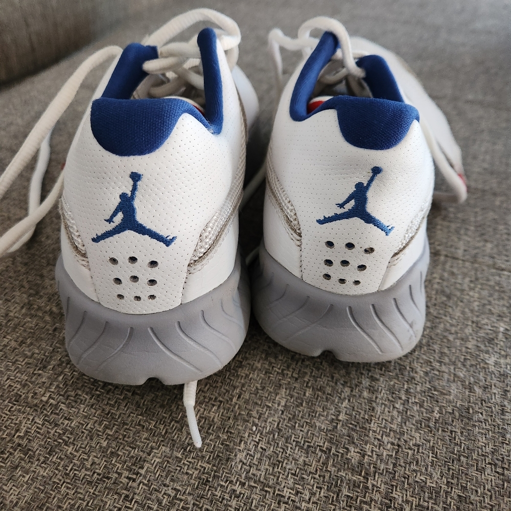 Size Y6 white Jordans with velcro strap over the laces.
